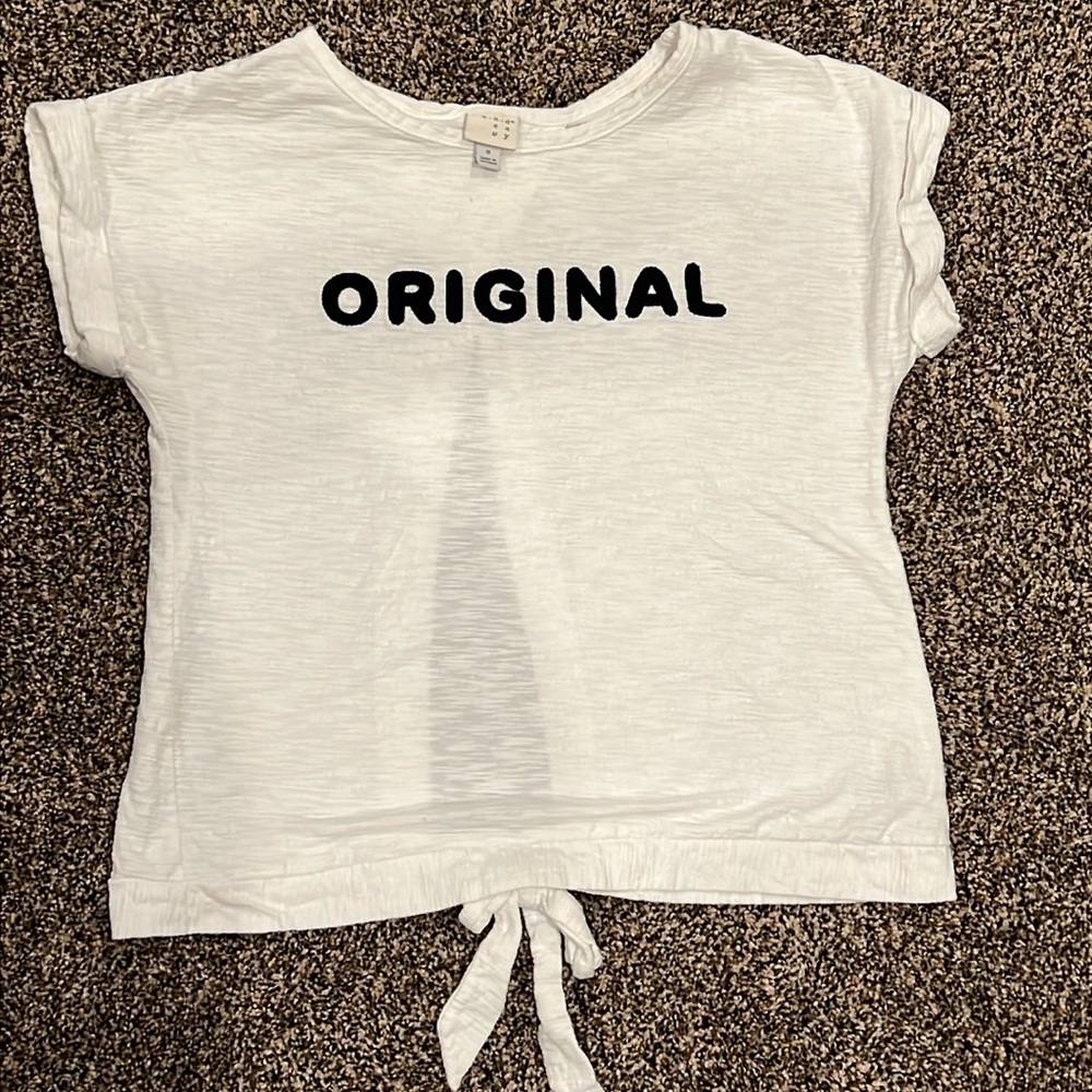 A New Day | Size Small | White open back tee with ORIGINAL on front